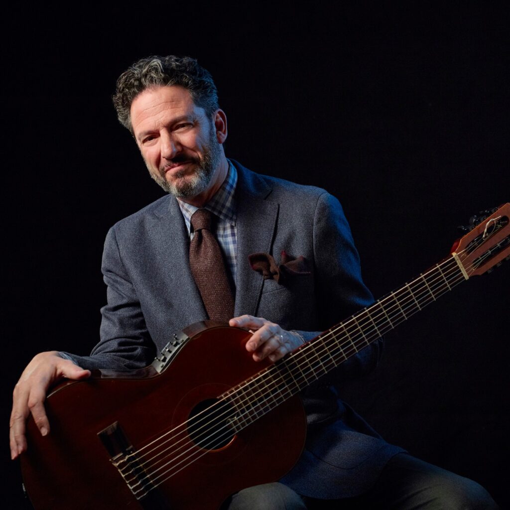 Man sits with his guitar